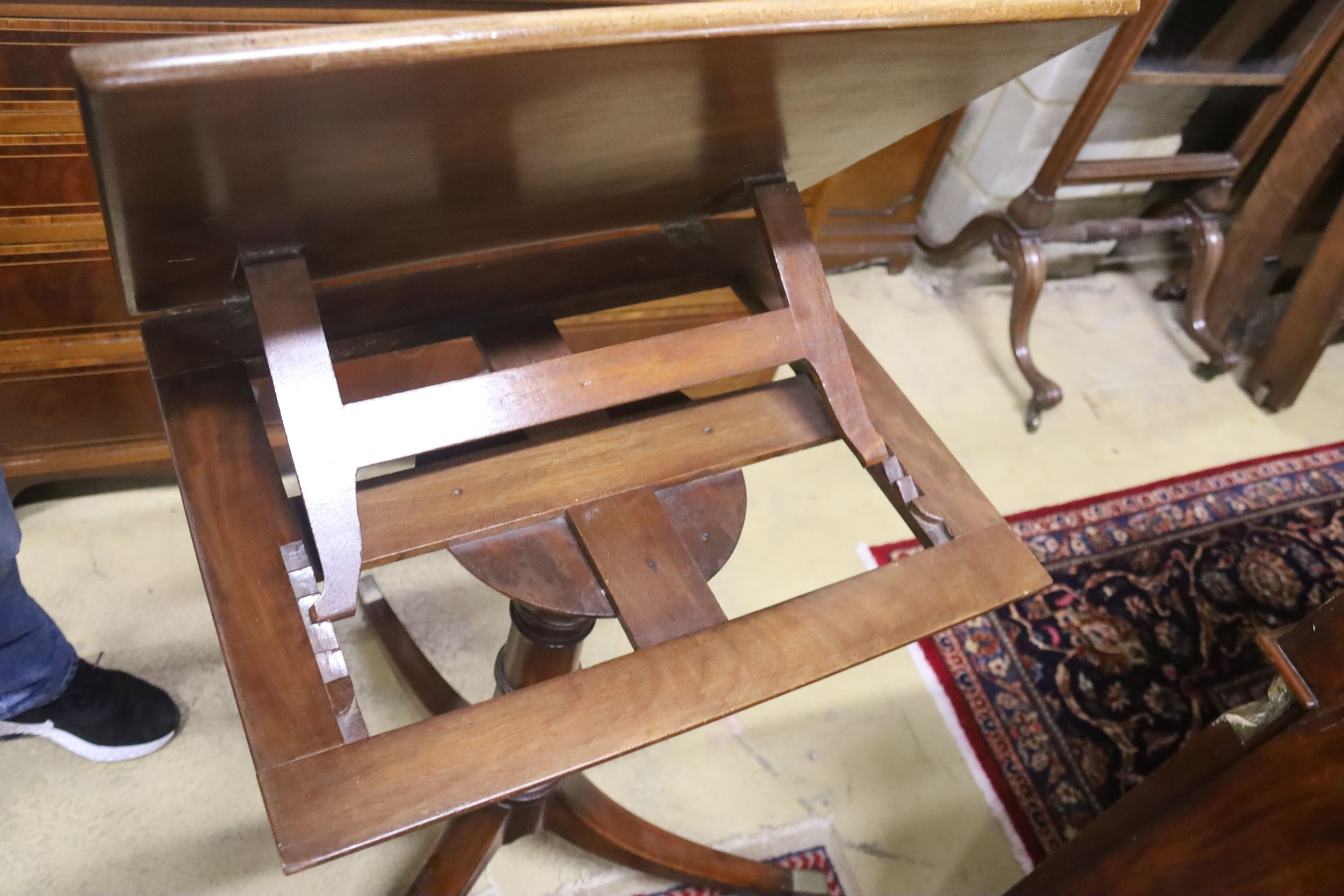 A George III style mahogany adjustable music stand, width 53cm, height 110cm